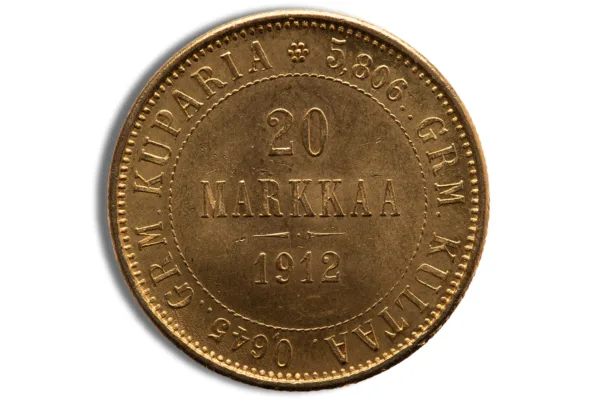 Gold 20 Markkaa coin from Finland, minted in 1912, featuring the inscription "20 MARKKAA" and "GRM. KUPARIA" along with the year and weight details. Ideal for collectors and enthusiasts of historical currency.