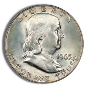 Silver 1963 Franklin half dollar coin featuring a profile of Benjamin Franklin, with the inscription "LIBERTY" and "IN GOD WE TRUST."