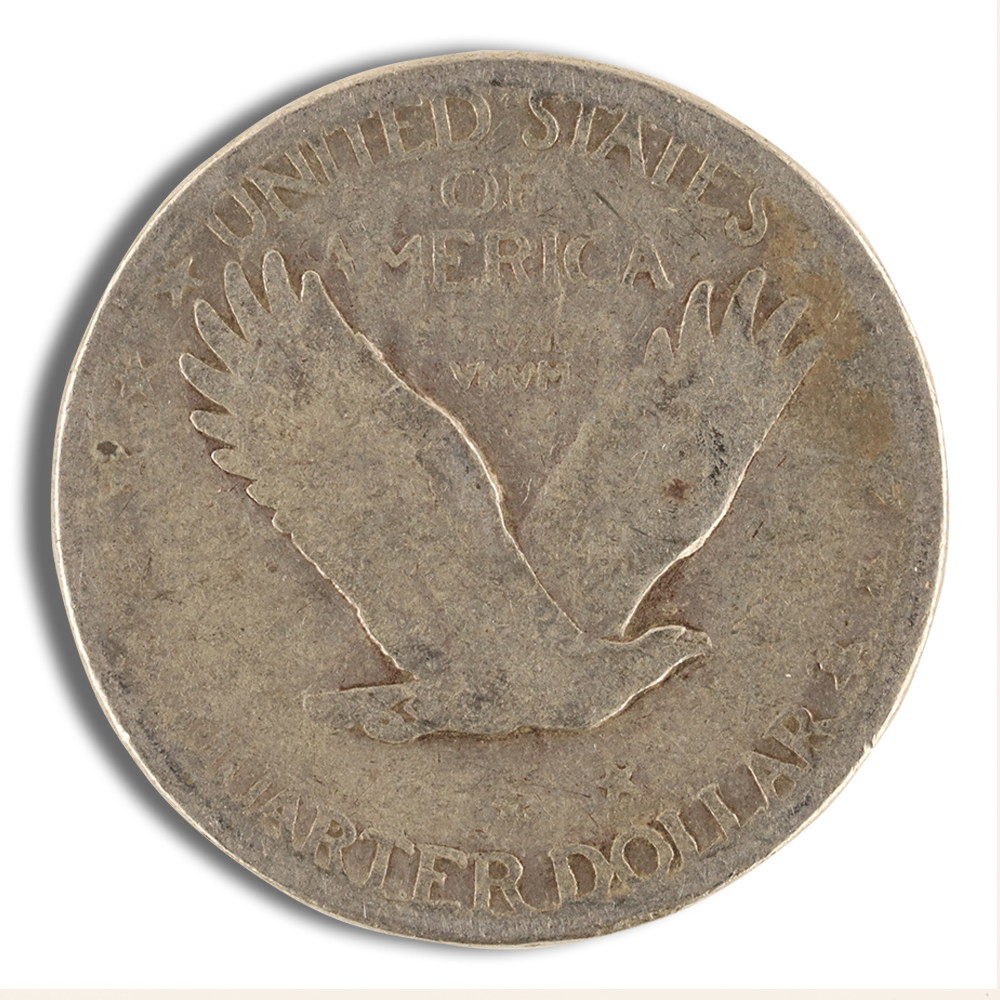 Close-up of a vintage United States quarter dollar coin featuring an eagle in flight, with the inscription "UNITED STATES OF AMERICA" and "QUARTER DOLLAR" visible, showcasing its historical design and aged patina.