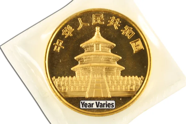 Gold commemorative coin featuring the Temple of Heaven in Beijing, China, with inscriptions in Chinese. Year of minting varies. Ideal for collectors and enthusiasts of Chinese numismatics.