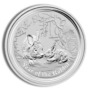 Silver coin featuring two rabbits, symbolizing the Year of the Rabbit, with intricate detailing and the inscription "Year of the Rabbit" at the bottom.
