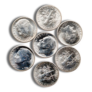 A collection of seven silver dimes arranged in a circular pattern, showcasing their distinct designs and details.