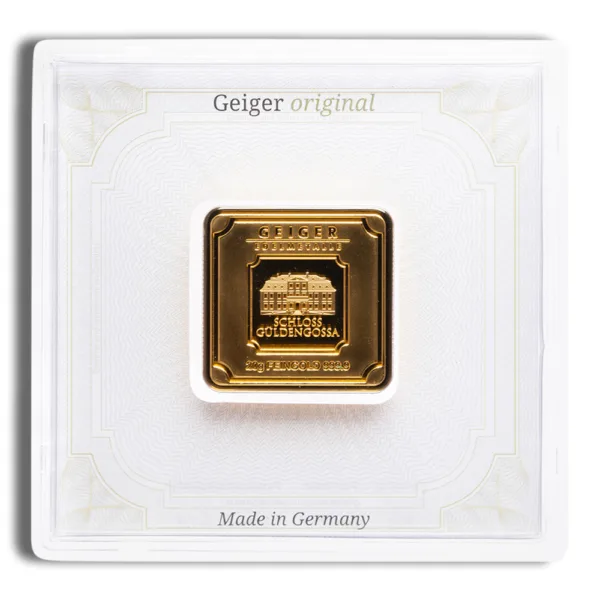 Gold bullion coin by Geiger Edelmetalle, featuring a square design with intricate details, encased in a protective white display holder, labeled "Made in Germany."