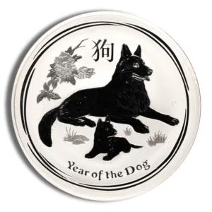 Silver coin featuring a black dog and puppy design, symbolizing the Year of the Dog in Chinese zodiac. The coin includes floral elements and inscriptions in both English and Chinese characters. Ideal for collectors and those celebrating the zodiac.