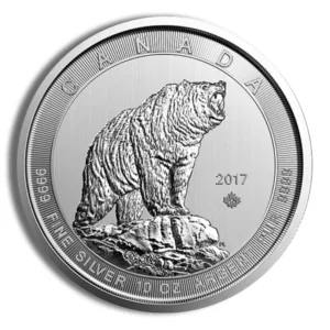 Silver coin featuring a detailed engraving of a bear, issued by Canada in 2017, with inscriptions indicating its fine silver content and weight of 10 ounces.