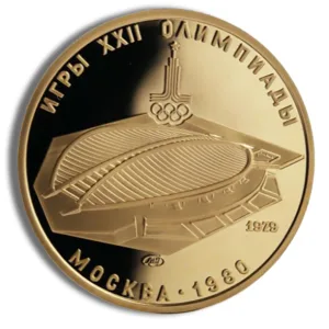 Gold medal from the 1980 Moscow Olympics, featuring the Olympic rings and a depiction of the Luzhniki Stadium, with the text "Игры XXII Олимпиады Москва 1980" engraved on the surface.