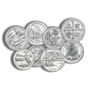 Collection of commemorative silver coins featuring various designs, including landscapes and state seals, arranged in a circular pattern.