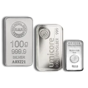 Three silver bars weighing 100 grams each, featuring brands R.M.R. Refinery, Umicore, and Geiger Edelmetalle, all with a purity of 999.9. Ideal for investors and collectors.