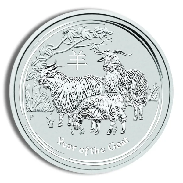 Silver coin depicting goats, representing the Year of the Goat in the Chinese zodiac, with intricate designs and a nature background.