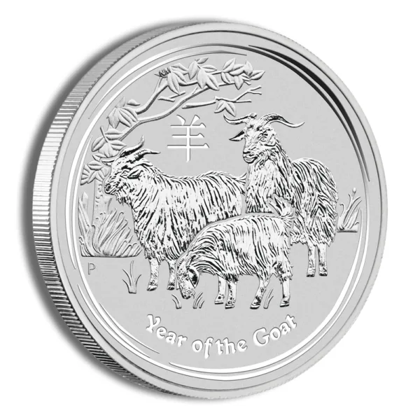 Silver coin featuring a detailed engraving of goats, symbolizing the Year of the Goat in the Chinese zodiac, with a decorative border and tree design.