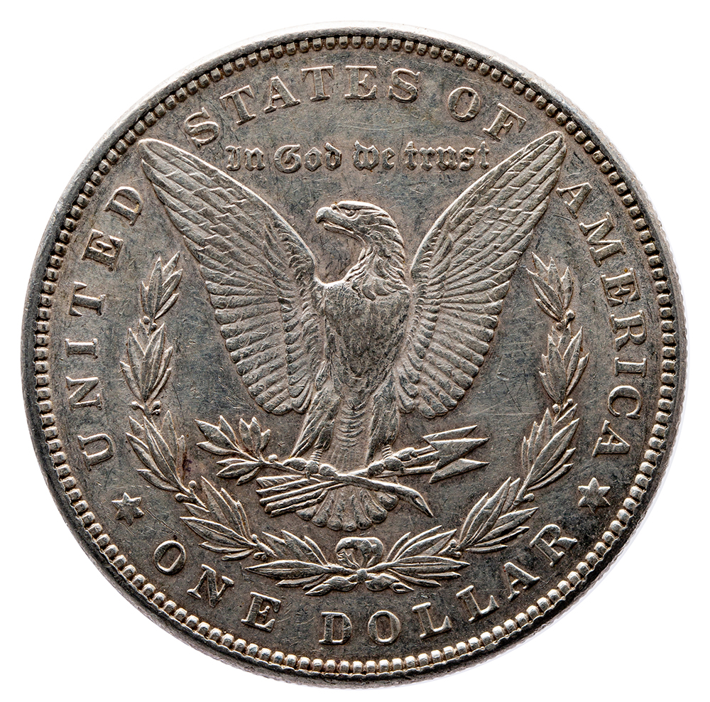 One US dollar coin featuring an eagle design, surrounded by the text "UNITED STATES OF AMERICA" and "ONE DOLLAR," showcasing intricate detailing and a vintage appearance.