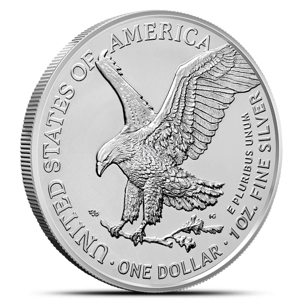 Silver American Eagle coin featuring an eagle in flight, inscribed with "United States of America," "One Dollar," and "1 oz Fine Silver." The design showcases intricate detailing and symbolizes American freedom and strength.
